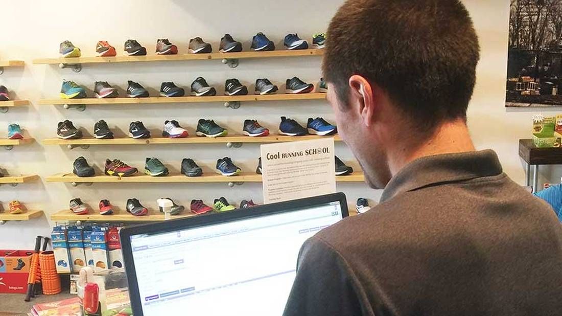 Man using a computer in a shoe store